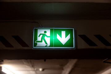 Emergency exit green light sign. 