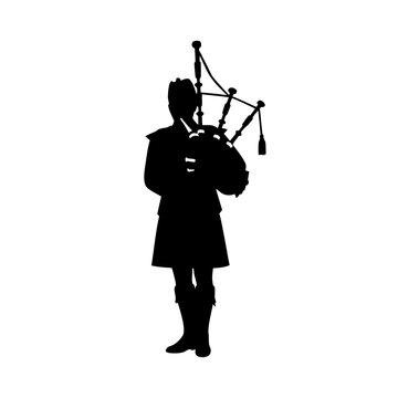 Silhouette of bagpiper playing music in traditional Scottish attire  