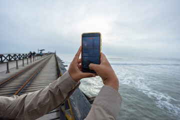 Photograph of the Pimentel Pier in Chiclayo, Peru a popular beach in northern Peru, known for its great food and rich coastal traditions