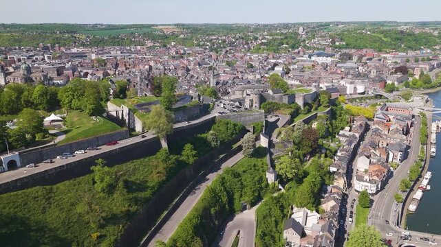 wallonia city belgium traffic roads prominent citadel namur to revealing left right pans aerial drone footage of citadelle de panning shot 