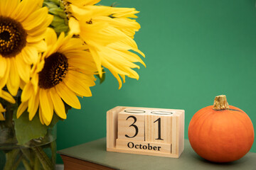 Halloween. Composition of sunflowers and pumpkins. Halloween Celebration on October 31