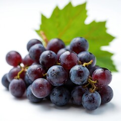Fototapeta premium Fresh red grapes with water droplets and green leaf on white background. Juicy berries are ready for eating or making wine. Healthy food for dessert and snack.