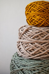 Colorful cotton yarn balls in craft studio — handmade textile and knitting materials