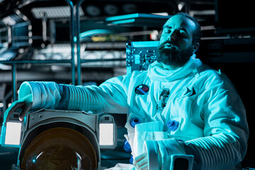 Exhausted cosmonaut falling asleep in spacecraft during long distance planetary mission. Tired orbital station crew member sleeping on floor during cosmic journey to other planets