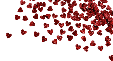 Red heart confetti falling against black background