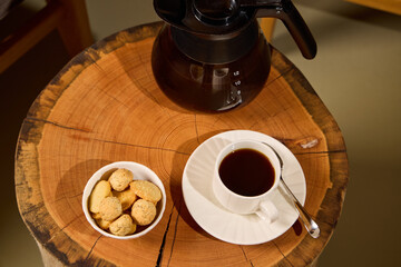 Indulge in a delightful Coffee Break accompanied by delectable Cookies on a lovely Wooden Table