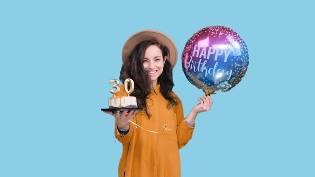 Smiling woman holding balloon, birthday cake with number 30 on the blue chroma key