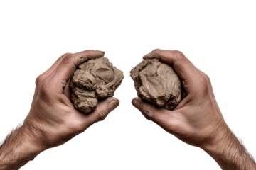 Two hands hold rough clumps of clay