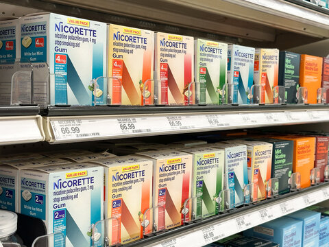 Novi, Michigan, US - 5 Oct 2025 : A full, well-stocked retail shelf display featuring two rows of Nicorette nicotine polacrilex gum in various flavors and dosages at Target retail store