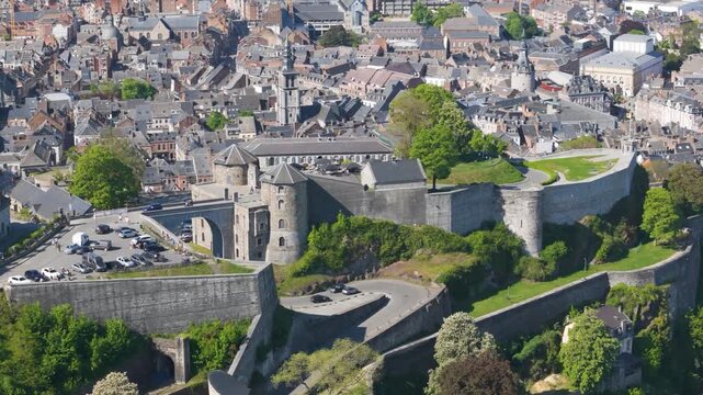 wallonia city beyond citadel namur belgium activity people walking vehicles circling aerial footage of citadelle de scenic overview 