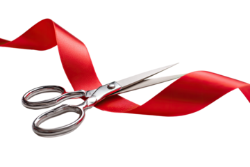 Scissors cutting a red ribbon