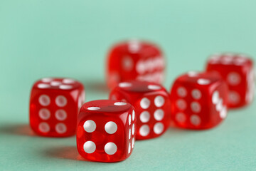 Red game dices on turquoise background