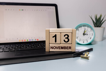 13 November on wooden grey cubes. Calendar cube date 13 November.