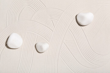 Spa stones on light sand. Zen concept
