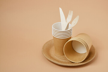 Eco paper plate fork on beige background no plastic, recyclable tableware
