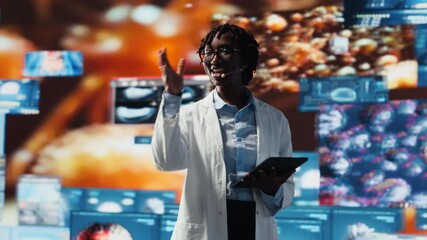Cheerful woman showing futuristic medical visuals on digital videowall during conference. Jolly African american doctor presenting medical research data and 3D anatomy models dashboards, camera B - Powered by Adobe