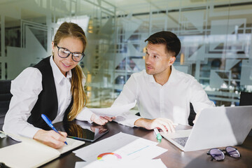 Business professionals engage in a collaborative meeting, discussing strategies and analyzing data in a modern office environment together