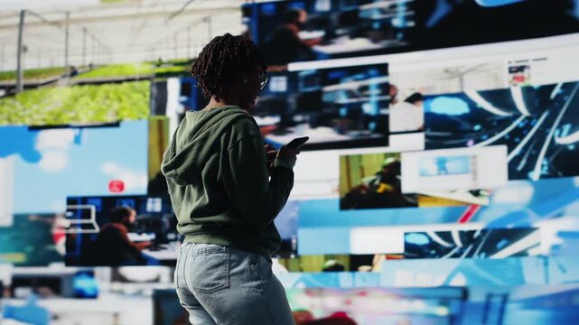 Jolly social media user enjoying free time browsing online clips on smartphone. Upbeat woman using phone to browse internet, looking at videos social network feed videos, camera B