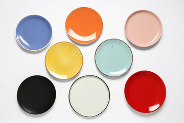 Colorful clean plates on white background
