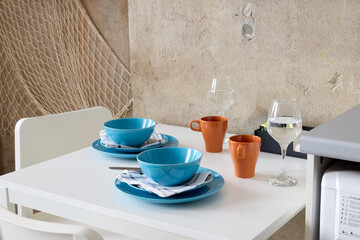 An Eclectic and Unique Dining Table Setup That Features Colorful and Vibrant Tableware