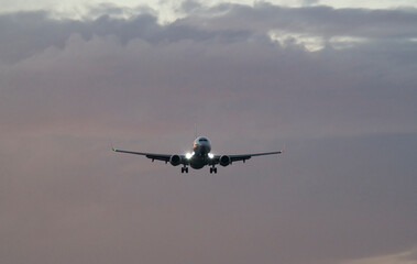 Plane Approaching Runway at Golden Hour