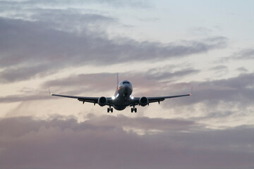 airplane in the sky - Commercial Plane Taking Flight at Dusk