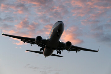 Airplane Landing in Vibrant Evening Colors