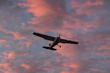 General Aviation Aircraft in Flight During Colorful Sunset