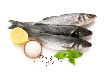 Fresh seabass fish, black peppercorns, basil leaves and bowl with salt isolated on white background, closeup