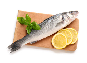Board with fresh uncooked sea bass fish, basil leaves and lemon isolated on white background, closeup
