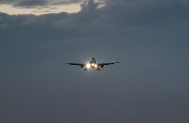 Commercial Plane Against Sunset Sky