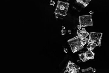 Ice cubes flying on black background