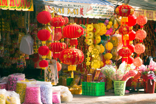 Ho Chi Minh City, Vietnam - 2016: Bright red Chinese New Year decorations adorn a market in Cholon, Ho Chi Minh City, Vietnam creating a festive atmosphere for Tet celebrations.