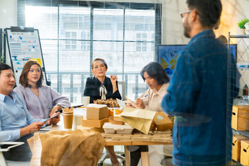 Corporate business team meeting discussion working plan in office room. Asian man employee writing on glass board presentation reusable Eco friendly product to colleague teamwork and project manager.