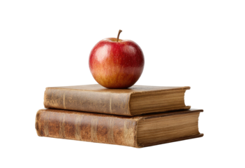 A ripe red apple sits atop two aged, stacked books