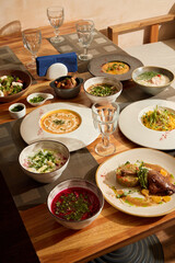 A Beautifully Colorful Array of Gourmet Dishes Displayed on a Rustic Wooden Table