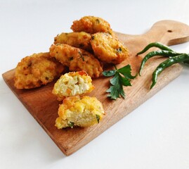 Perkedel tahu or fried tofu patties. Made of mixture; mashed tofu, small amount of tapioca flour, spring onion, egg, salt and pepper and deep fried. Crunchy outside,soft inside.