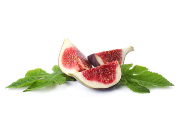 Pieces of fresh ripe fig and leaves on white background