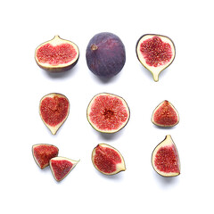 Cut fresh ripe figs on white background