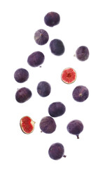 Flying many fresh ripe figs on white background