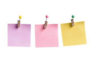 Three colorful sticky notes, each affixed to a dark background with wooden clothespins