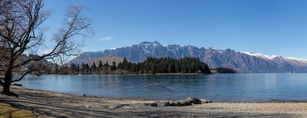 Snow capped Remarkables over Wakatipu Lake in winter