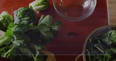 Fototapete Aroma Showing bunch of parsley on red cutting board beside glass mixing bowl in kitchen, copy space  © vectorfusionart