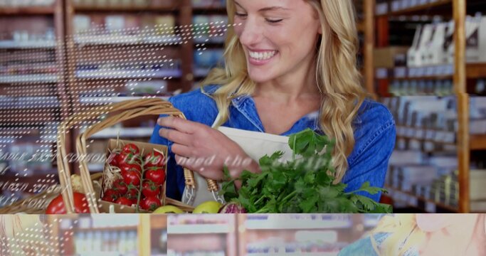 Smiling woman wearing apron arranging tomatoes, leafy greens in wicker basket in supermarket aisle