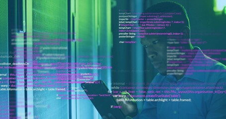 Technician in blue shirt examining rack LEDs in data center, with touchscreen device, copy space