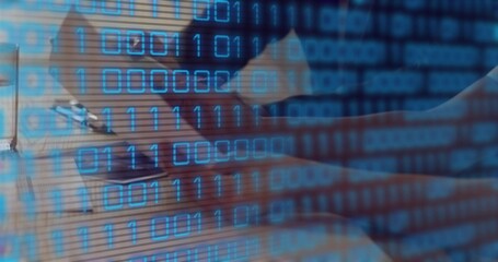 Man wearing button up shirt writing in notebook, typing on laptop at workspace, binary code overlay