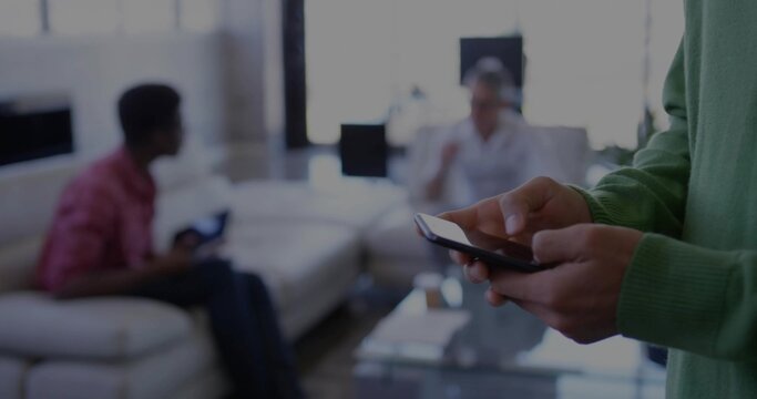 Checking smartphone, Korean man at home, friends gaming on sofa with controller, copy space