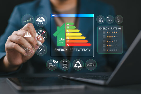 Energy efficiency Improvement concept, Eco-friendly homes for sustainable development. Businessperson using laptop to energy efficiency rating assessment.