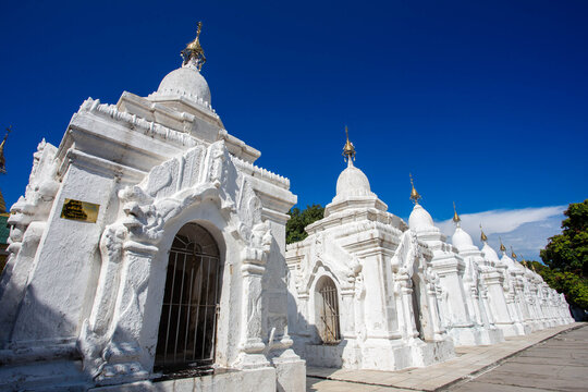 The World&rsquo;s Largest Book: Majestic White Stupas of Kuthodaw Pagoda Under a Deep Blue Sky in Mandalay, Myanmar