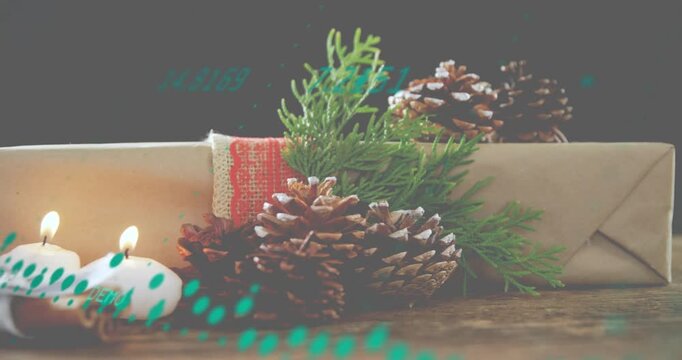 Particle wave sweeping over gift drawing attention to candles sliding and igniting for festive mood
